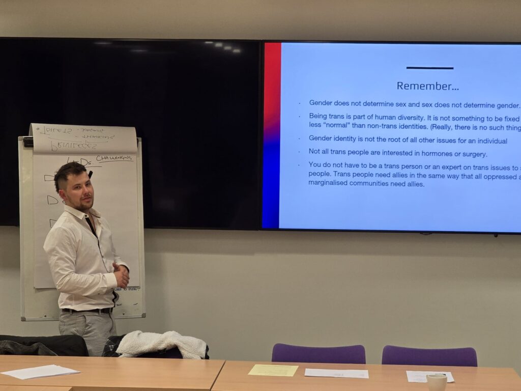 Connor Freel delivering trans ally training, Cardiff, 2025